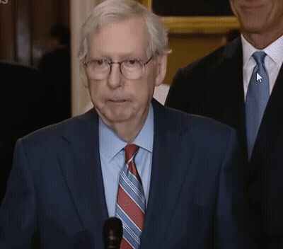 Man In Suit With Arrow Pointing To Tie GIF