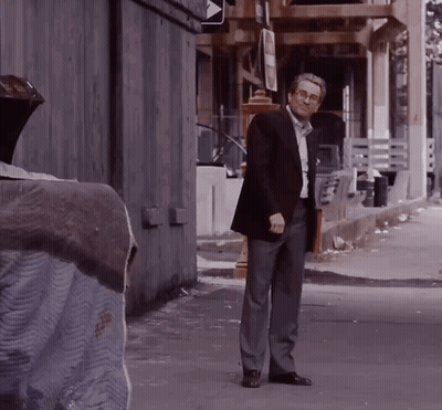Man In Suit With Briefcase In Alleyway GIF