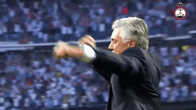 Man In Suit With Crowd And Soccer Logo GIF