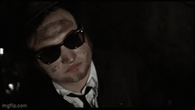 Man In Suit With Dirty Face GIF