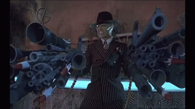 Man In Suit With Guns Saying Bang GIF