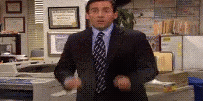 Man In Suit With Hands In Air GIF