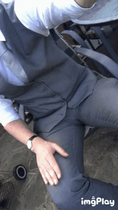 Man In Suit With Hands On Hips And Watch GIF