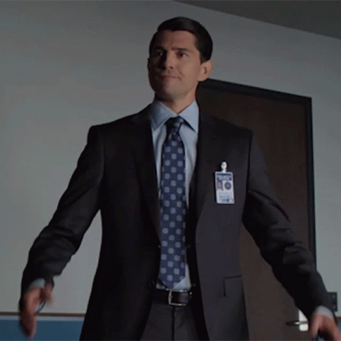 Man In Suit With James Name Tag GIF