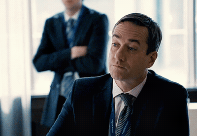 Man In Suit With Lanyard Saying County Affairs GIF