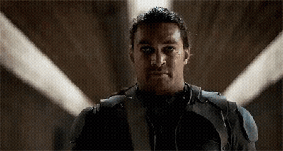 Man In Suit With Light Behind GIF