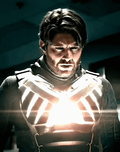 Man In Suit With Light On Chest GIF