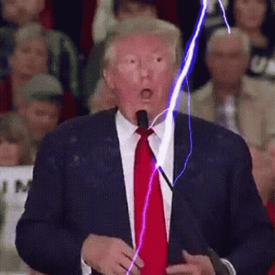 Man In Suit With Lightning Coming Out Of Mouth GIF