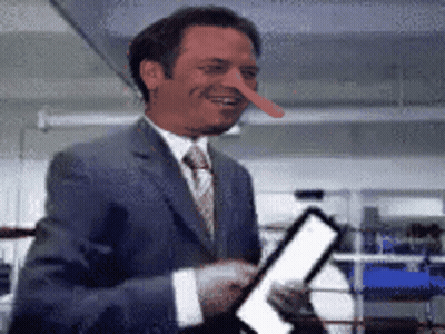 Man In Suit With Long Nose Smiling GIF
