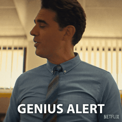 Man In Suit With Microphone And Water At Desk GIF