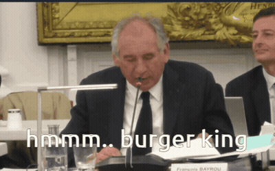Man In Suit With Microphone Saying Hmm GIF