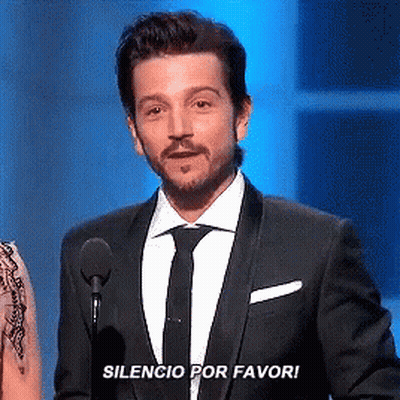 Man In Suit With Microphone Silencio Por Favor GIF