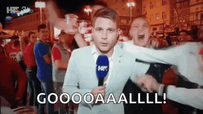Man In Suit With Microphone Yells Goooooaaalll GIF