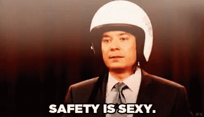 Man In Suit With Motorcycle Helmet Says Safety Is Sexy GIF