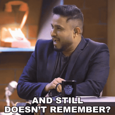 Man In Suit With Mug Saying And Still Doesn't Remember GIF