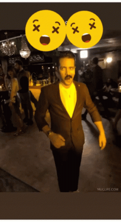 Man In Suit With Mustache In Front Of Two Smiley Faces Saying X And X GIF