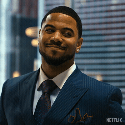 Man In Suit With Netflix Logo GIF
