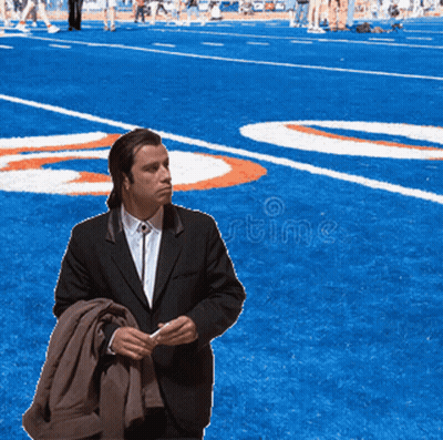 Man In Suit With Number 20 On Football Field GIF