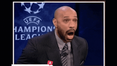 Man In Suit With Open Mouth Champions League Logo GIF