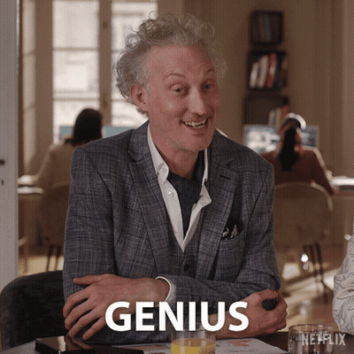 Man In Suit With Orange Juice Saying Genius GIF