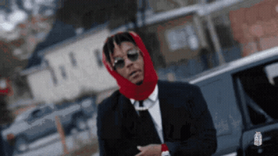 Man In Suit With Red Scarf On Head GIF
