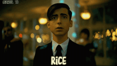 Man In Suit With Rice On Chest GIF