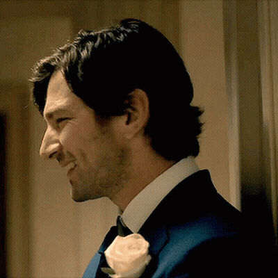 Man In Suit With Rose In Lapel GIF