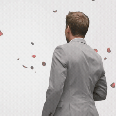 Man In Suit With Rose Petals GIF