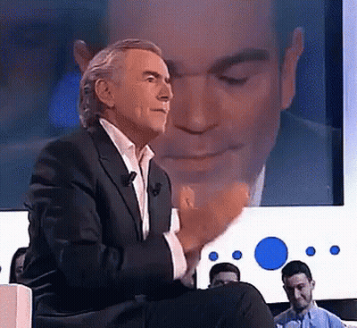 Man In Suit With Screen Reflection GIF