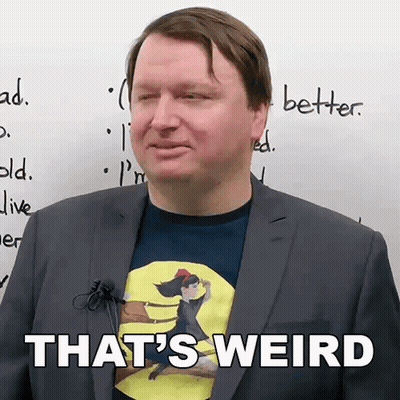 Man In Suit With Shirt Saying That's Weird GIF