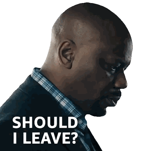 Man In Suit With Should I Leave Sticker