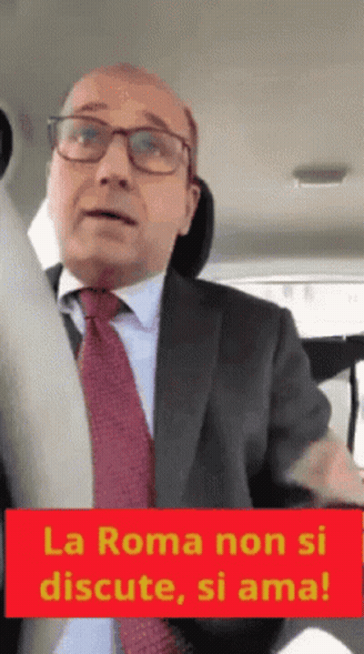 Man In Suit With Sign La Roma Non Si Discute Si Ama GIF