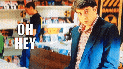 Man In Suit With Sign Saying Oh Hey GIF