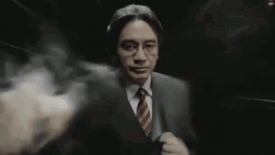 Man In Suit With Smoke Coming Out Of Mouth GIF
