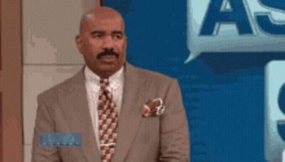 Man In Suit With Speech Bubble Saying A GIF