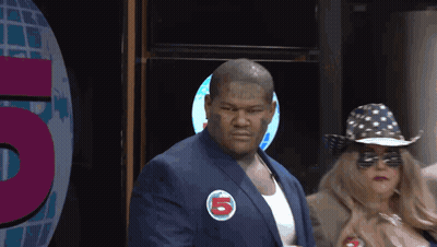 Man In Suit With Sticker Saying 5 GIF