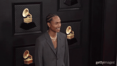 Man In Suit With Trophies GIF