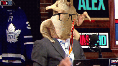 Man In Suit With Turkey On Head And Maple Leafs Jersey GIF