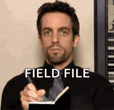 Man In Suit Writing In Notebook GIF