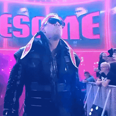 Man In Sunglasses And Bandana In Front Of Esome Sign GIF