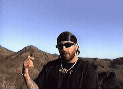 Man In Sunglasses And Bandana In Mountains GIF