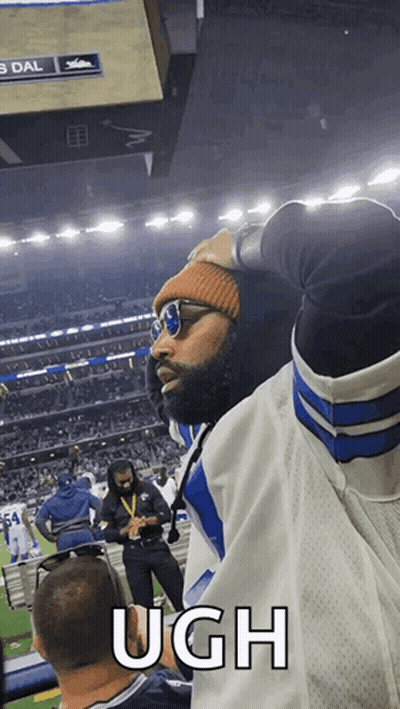Man In Sunglasses And Beanie Says Ugh At Football Game GIF