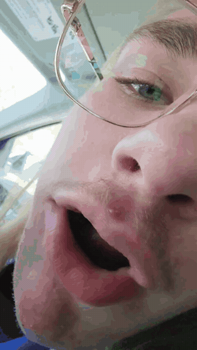Man In Sunglasses And Beanie Sitting By Door GIF