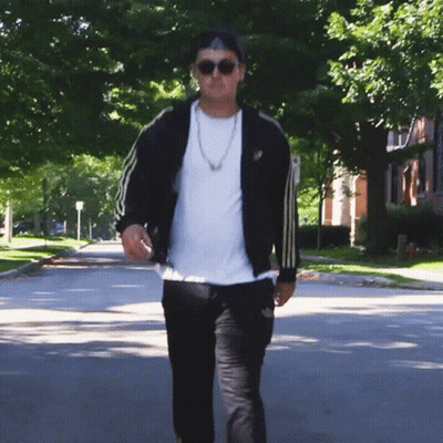Man In Sunglasses And Black Adidas Jacket Walking GIF
