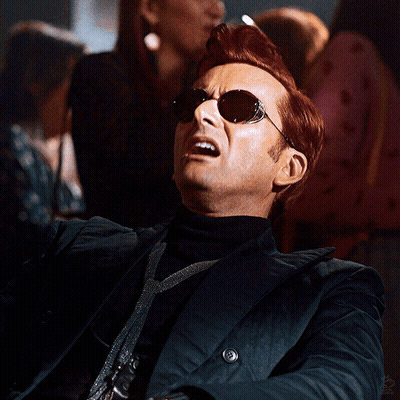 Man In Sunglasses And Black Jacket Looking Up GIF