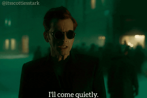 Man In Sunglasses And Black Jacket Says I'll Come Quietly GIF