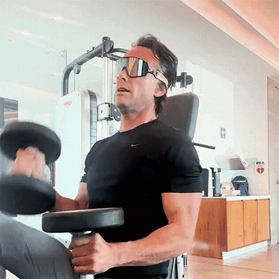 Man In Sunglasses And Black Nike Shirt Lifting Dumbbell GIF