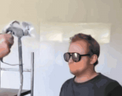 Man In Sunglasses And Black Shirt Being Photographed GIF