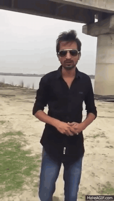 Man In Sunglasses And Black Shirt By Bridge GIF