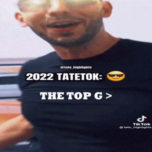 Man In Sunglasses And Black Shirt Says 2022 Tatetek The Top G GIF